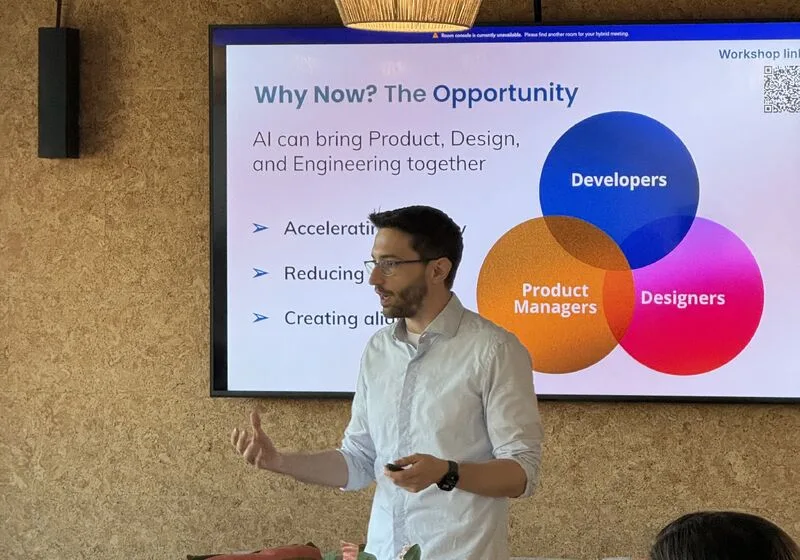 Jorge Alcantara speaking beside a slide titled Why Now? The Opportunity at ProductTank Porto.