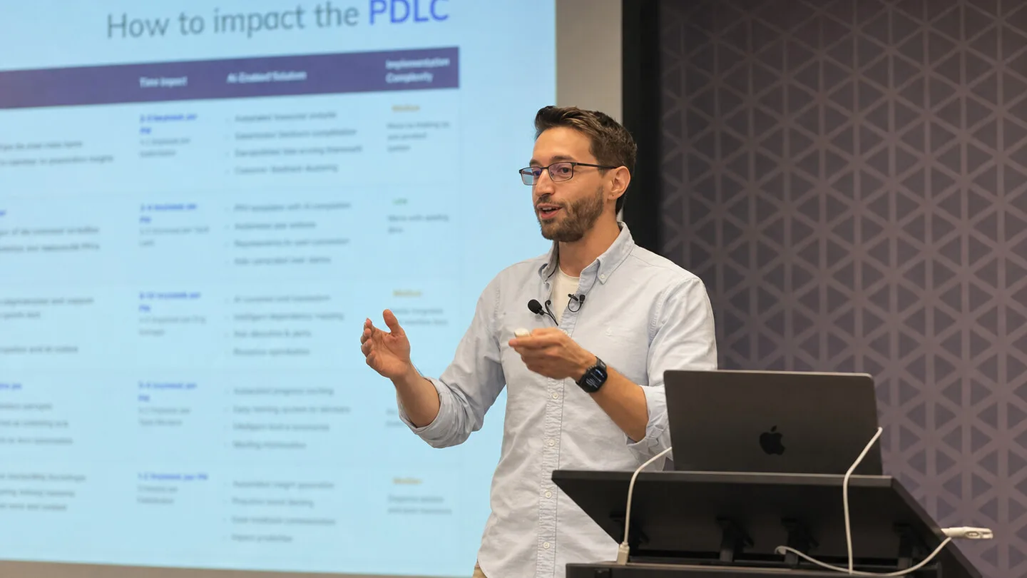 Promotional speaker artwork showing Jorge Alcantara presenting beside a softly blurred PDLC slide.
